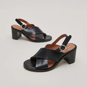 Heeled sandals in black leather